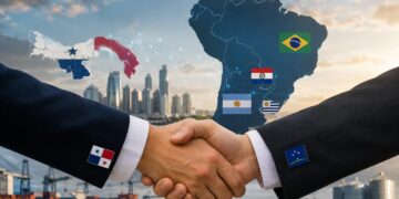Ilustración realista de un apretón de manos entre Panamá y los países del MERCOSUR, con el mapa de Sudamérica, banderas de Brasil, Argentina, Paraguay y Uruguay, y elementos de comercio y logística al fondo. - Tu Política